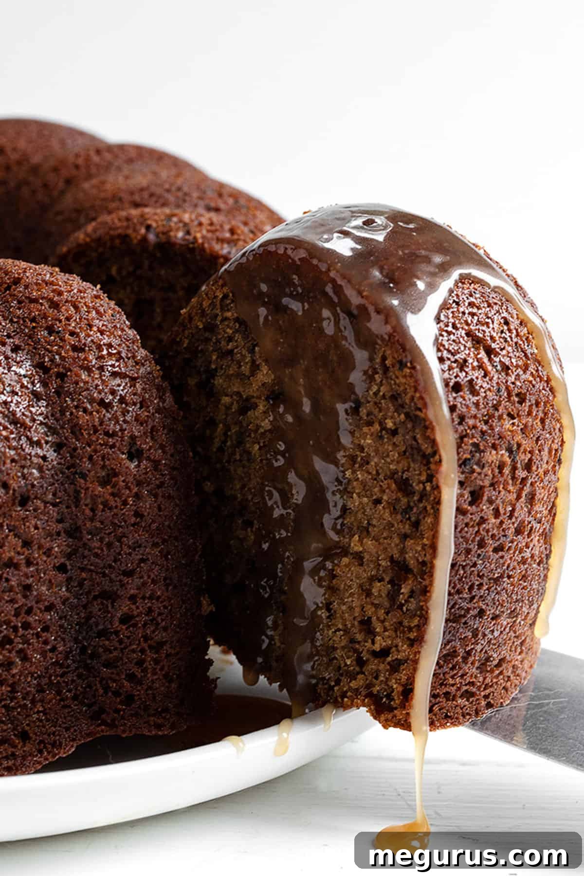 Sticky Toffee Bundt Cake sliced on a plate, ready to be served