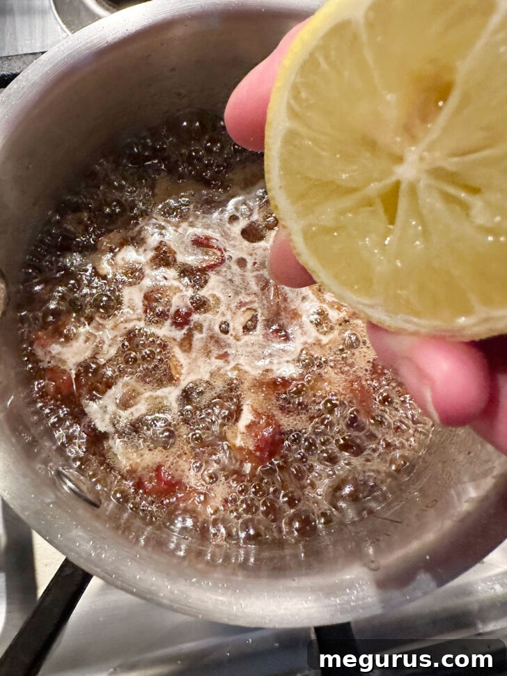 Stirring lemon juice into the cooked date filling.