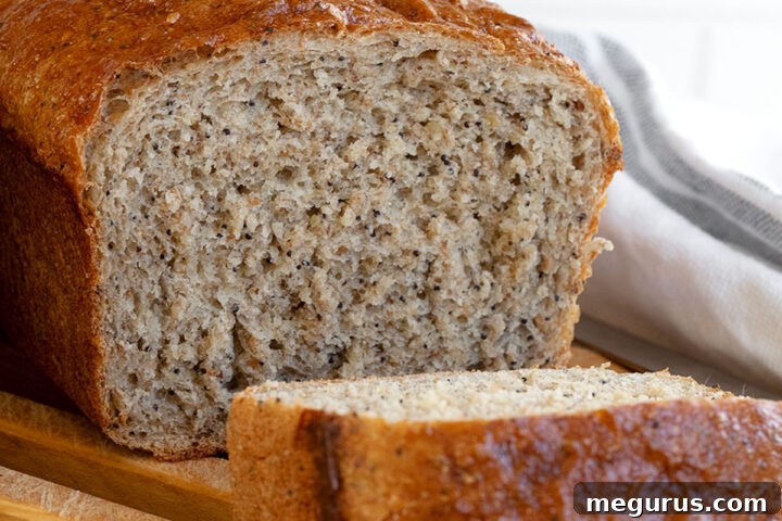 Whole wheat seed bread sliced on cutting board with a recipe card overlay.