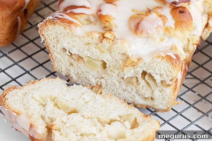chunky apple bread sliced on cooling rack