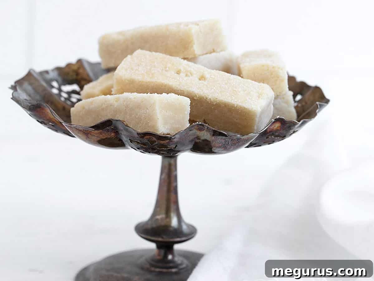 Classic sheet pan shortbread cookies arranged beautifully on a vintage silver tray