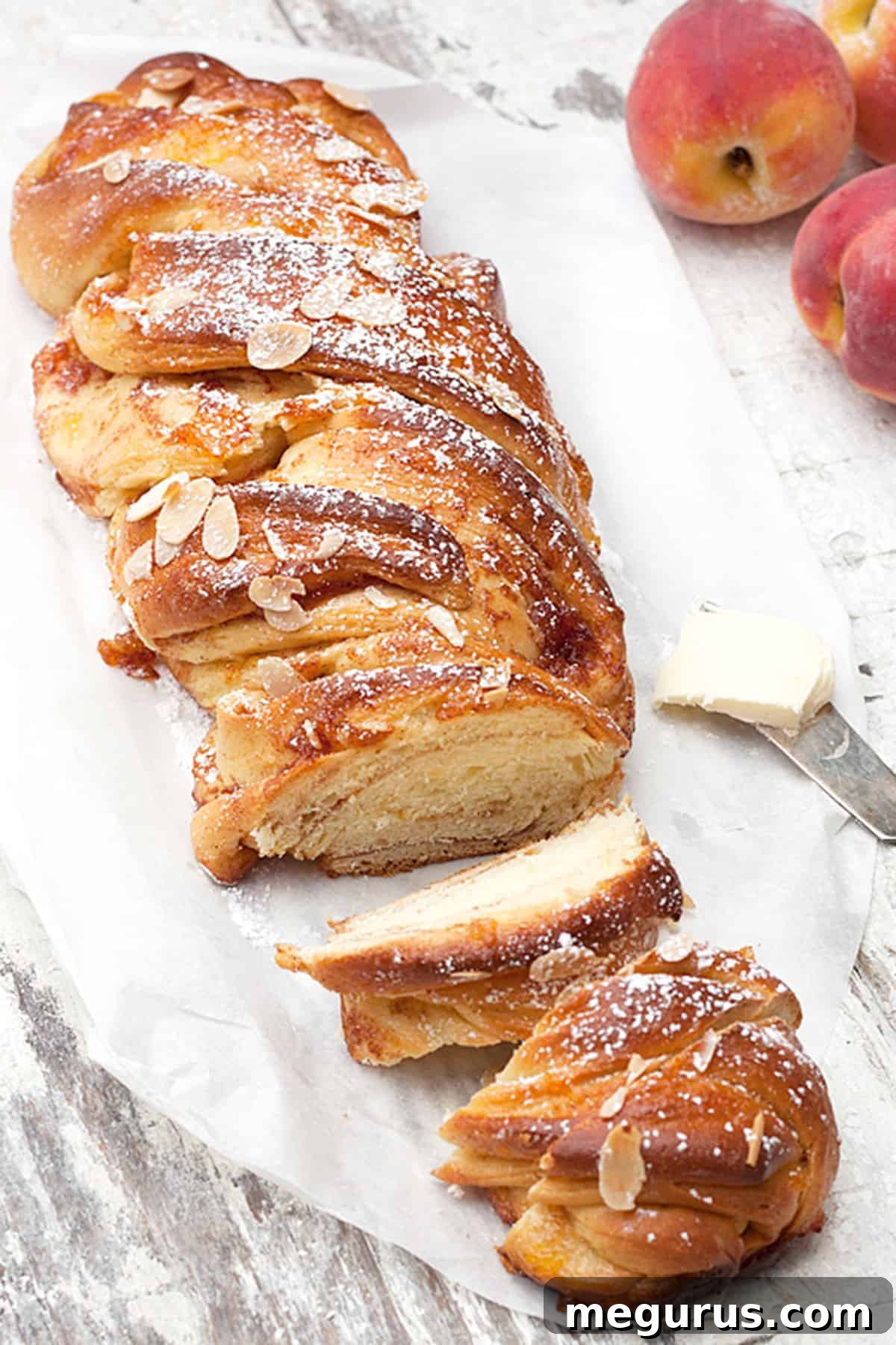 peach flip bread dusted with powdered sugar and a cup of coffee