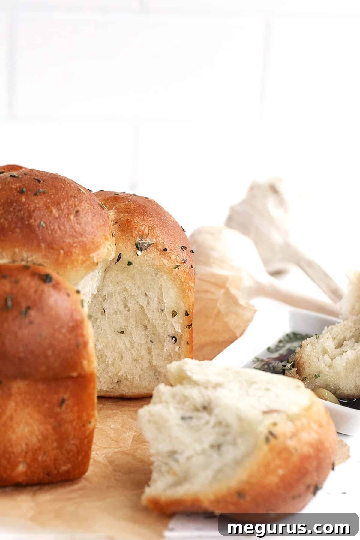 Close-up of baked garlic and herb pull apart focaccia rolls