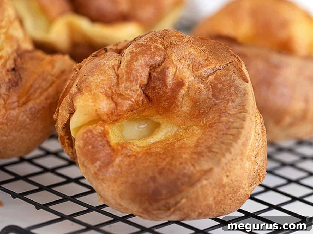 Classic Yorkshire Pudding on cooling rack, golden and puffed