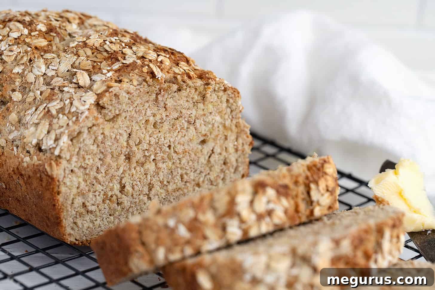 Irish brown soda bread sliced on cooling rack, showcasing its wholesome texture
