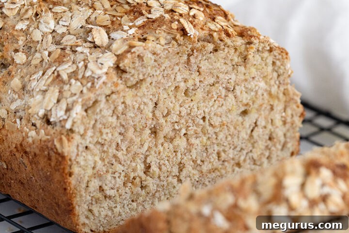 Irish brown soda bread sliced on cooling rack, ready to serve.