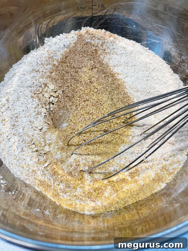 Dry ingredients in bowl with whisk, ready for mixing.