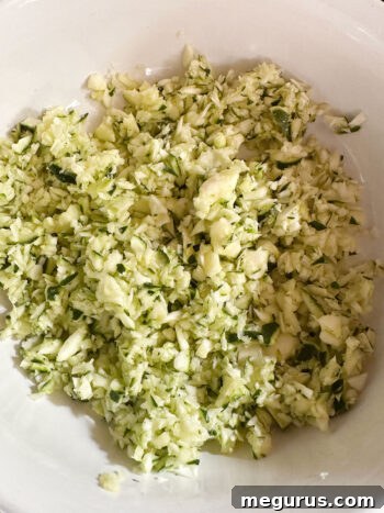 Finely chopped zucchini in a bowl.