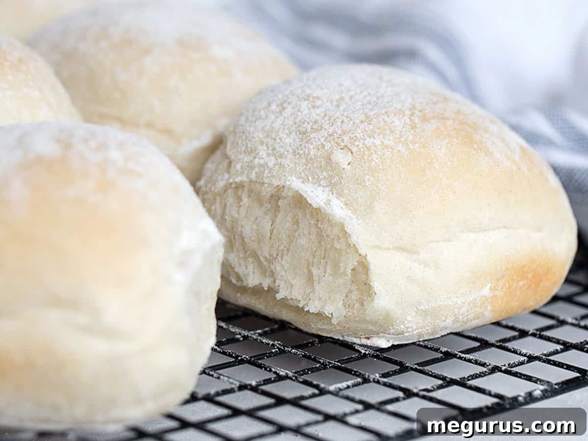 Freshly baked Irish Blaa buns cooling on a wire rack, ready to be enjoyed.