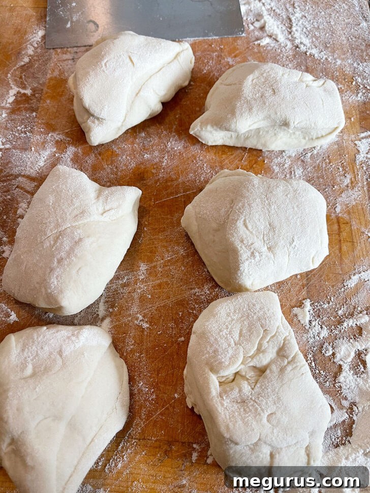 Dividing the dough into 6 equal pieces for shaping.