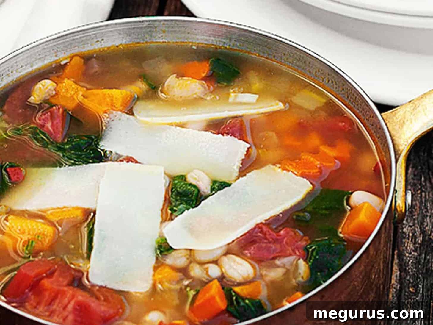 Rich and vibrant harvest vegetable soup simmering in a rustic copper pot, ready to serve.