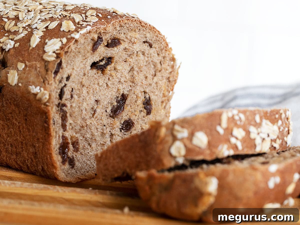 cinnamon raisin oatmeal bread sliced on cutting board