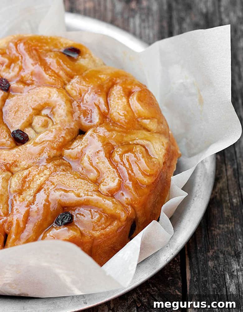 Close-up of freshly baked honey buns showing their golden glaze and rich texture.