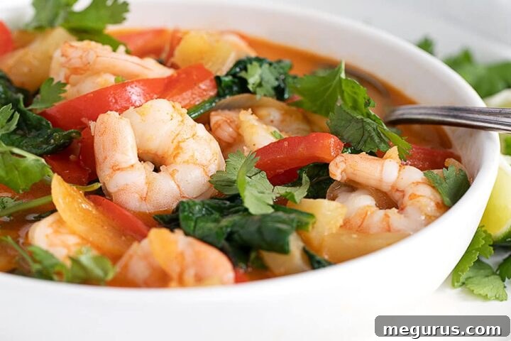 Thai red curry shrimp in white bowl