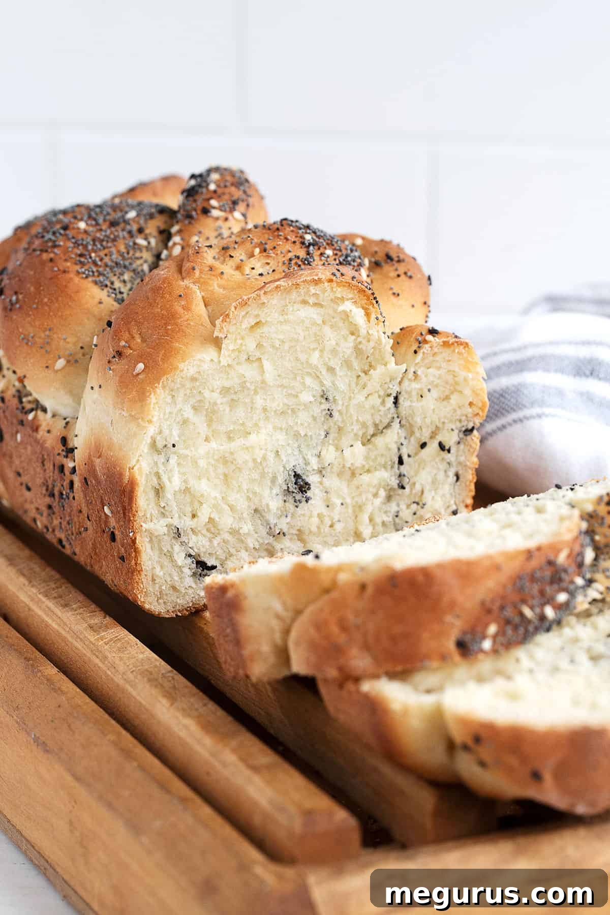 Everything Bread sliced on a cutting board, ready to be served.