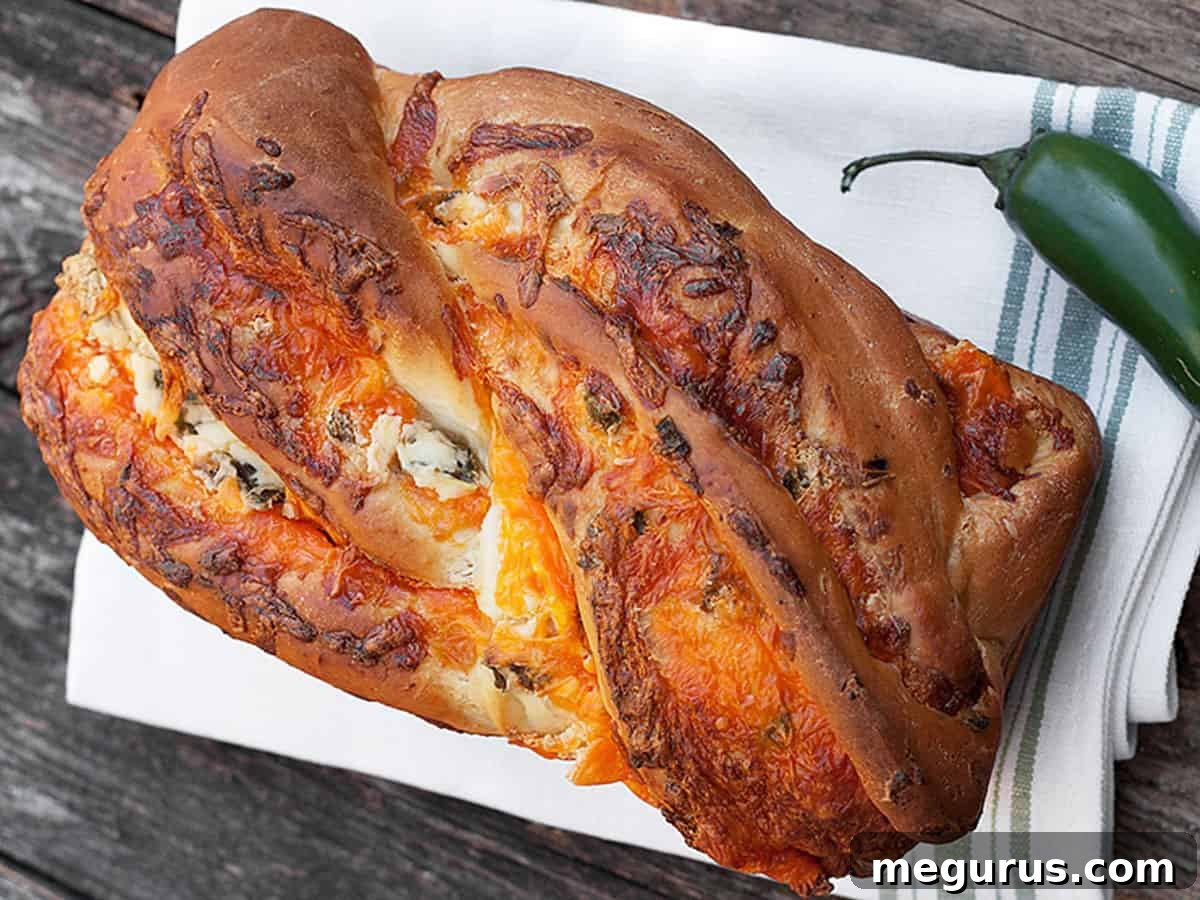 Delicious Jalapeño Popper Cheese Bread loaf, freshly baked and sliced