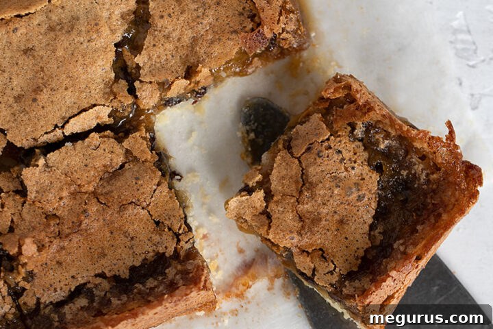 butter tart squares cut on parchment paper