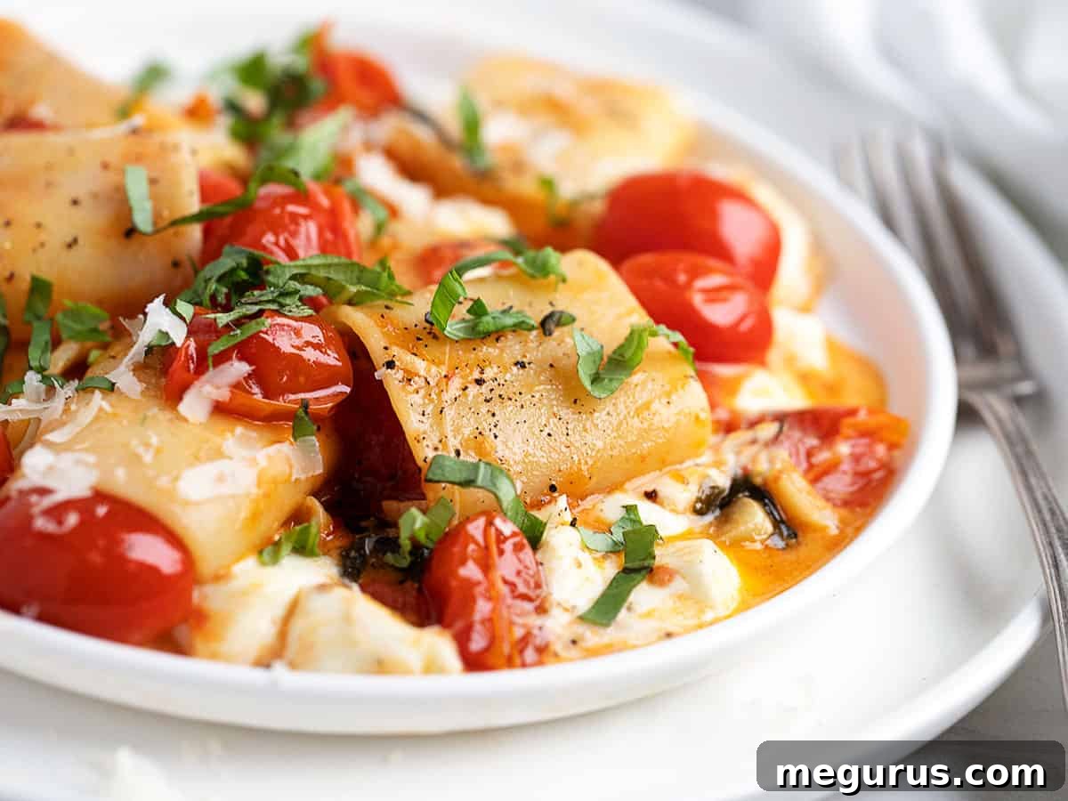 Classic Pasta alla Sorrentina with Paccheri, burst tomatoes, and mozzarella
