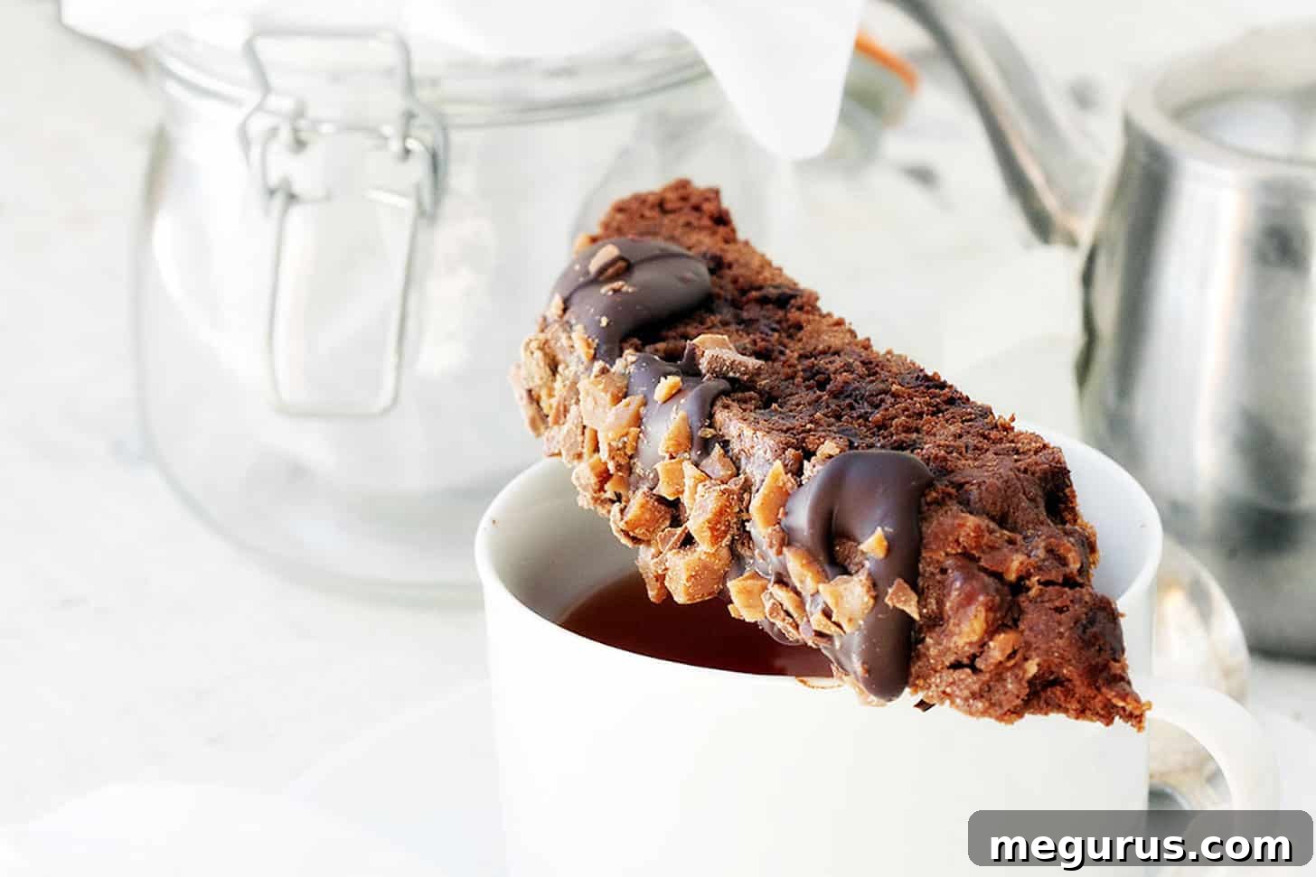double chocolate toffee biscotto on top of coffee cup