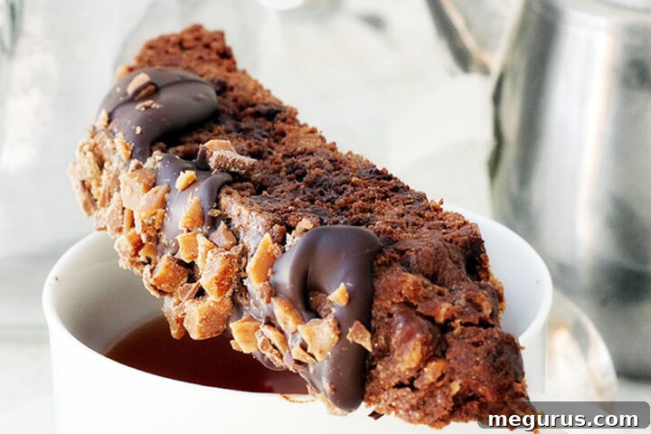 double chocolate toffee biscotto on top of coffee cup