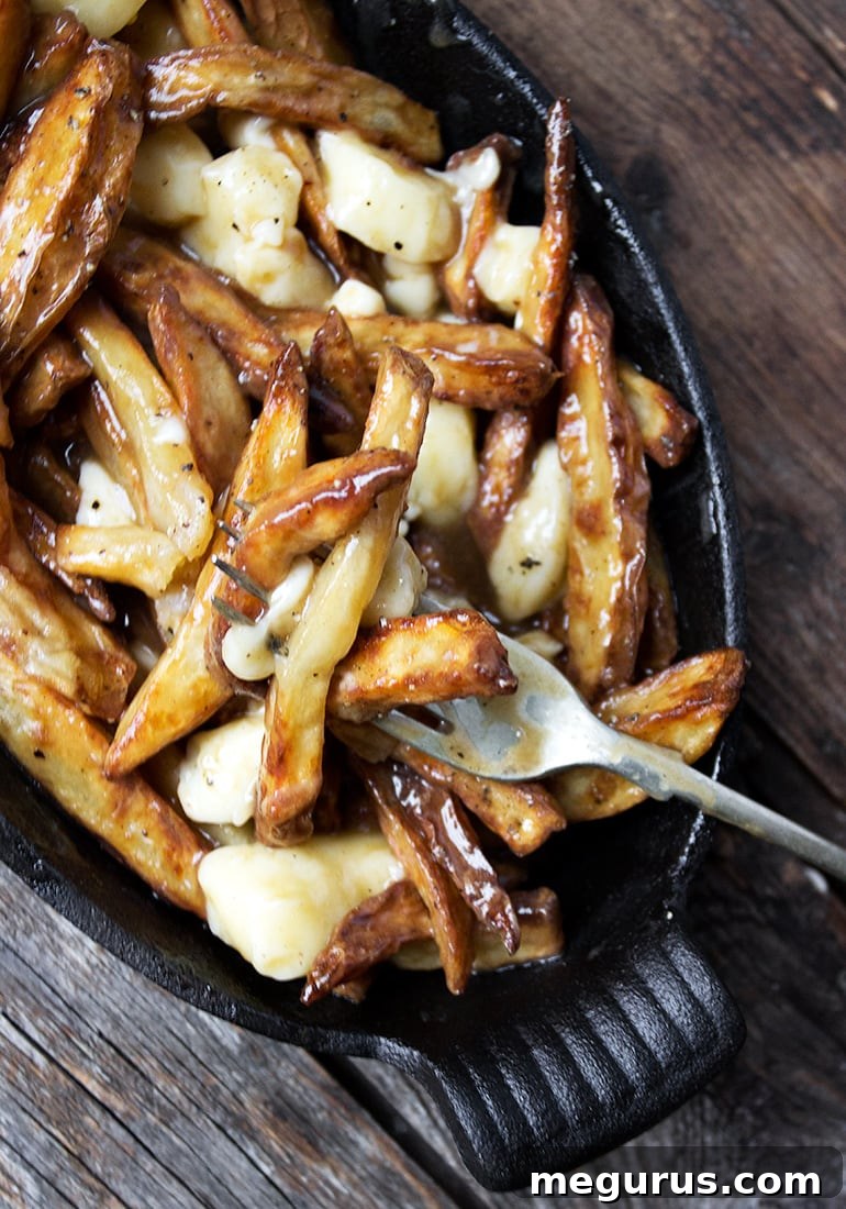 Classic Canadian Poutine, a plate of fries, gravy, and cheese curds