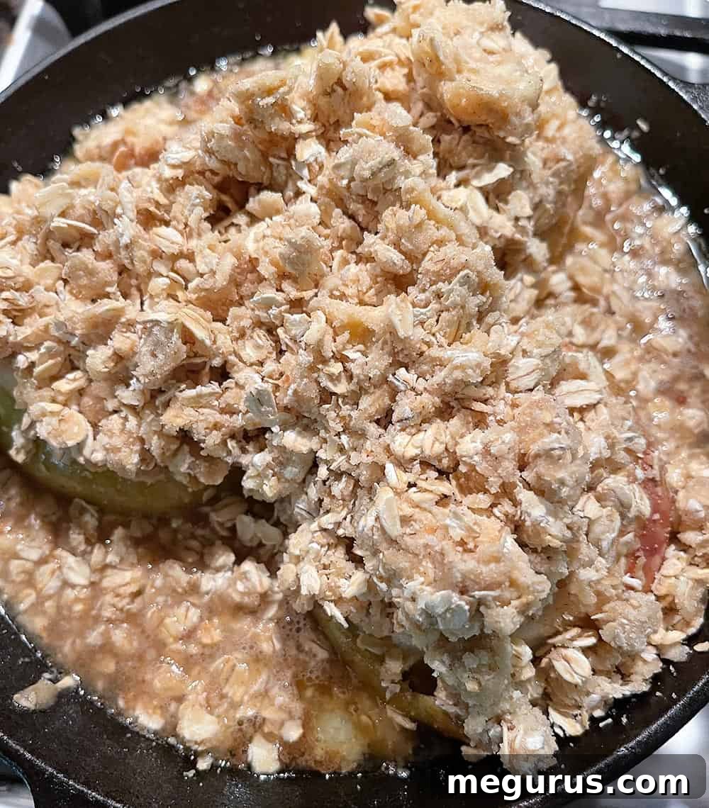 Step-by-step photo showing crumble topping being spooned over roasted apples.