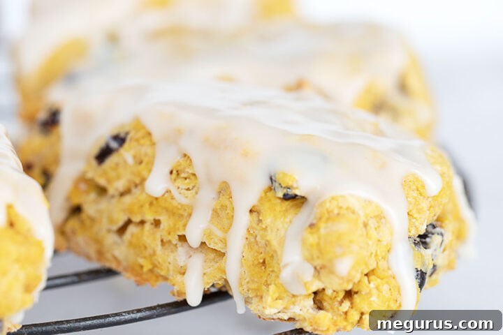 Maple glazed pumpkin scones on cooling rack.
