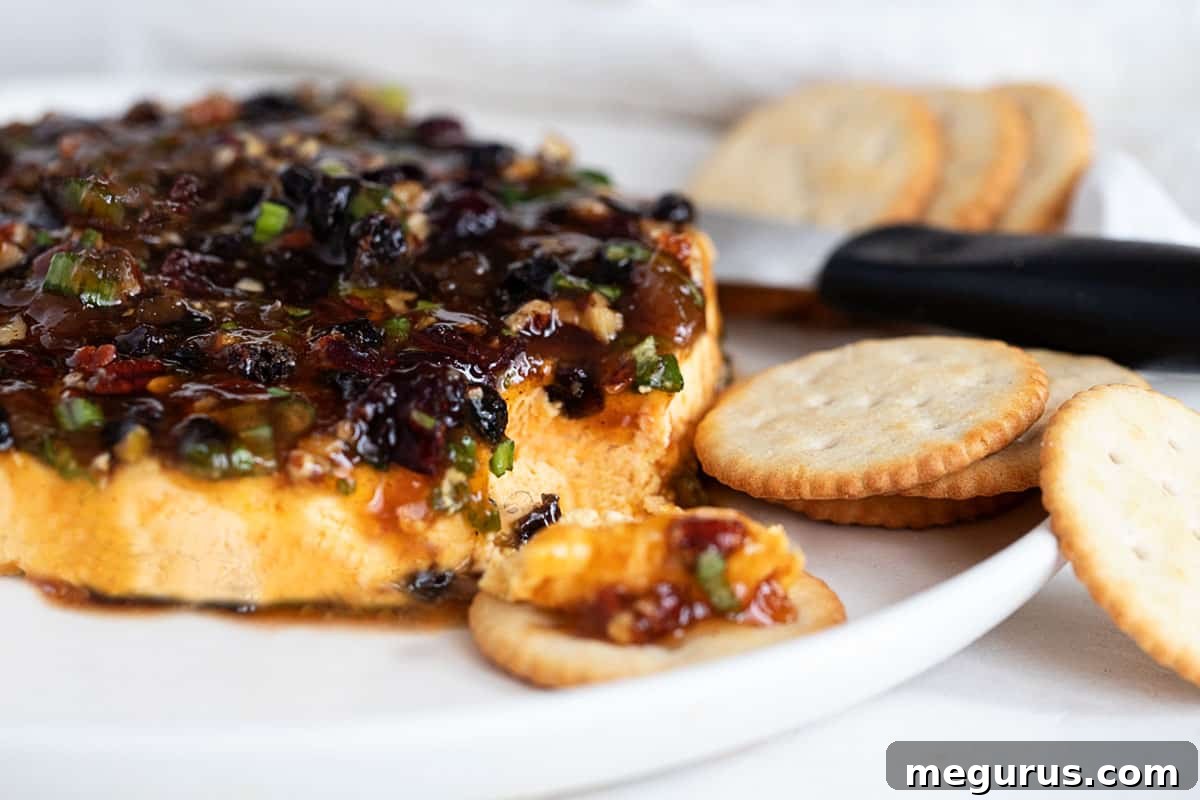 curried cheese spread with mango chutney on top, served with crackers and fruit