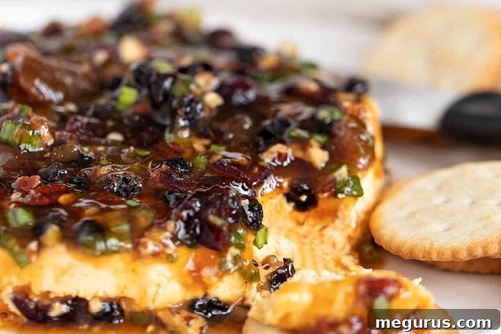 curried cheese spread with mango chutney on top