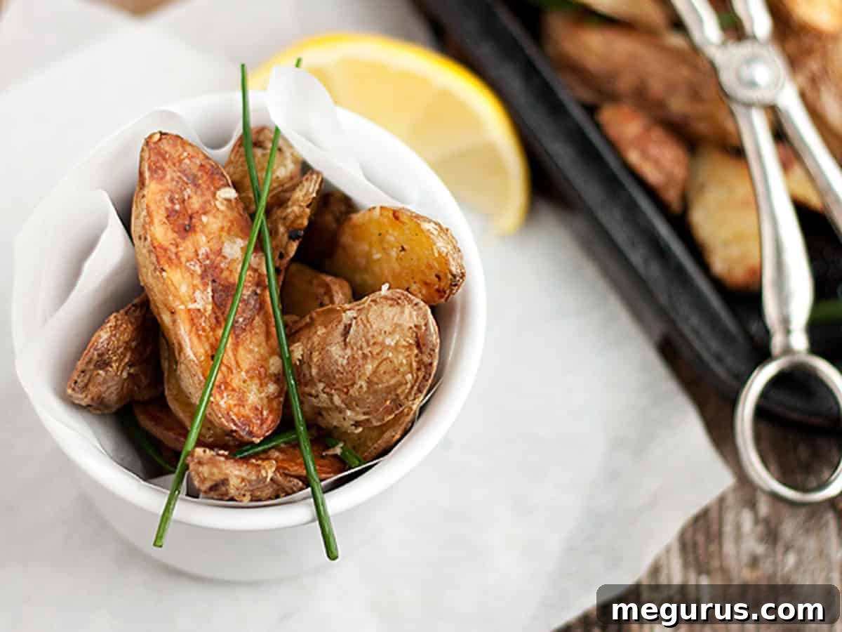 parmesan fingerling potatoes in bowl and on baking sheet