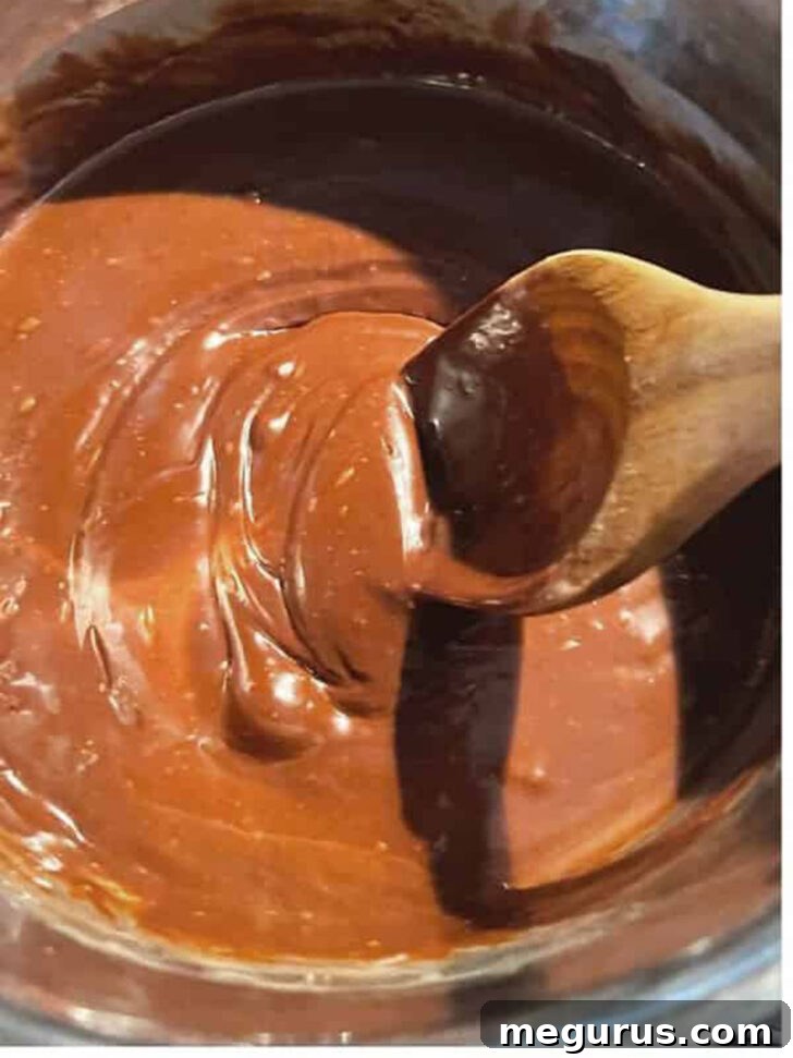 Smooth, glossy chocolate filling after cooking and stirring in walnuts.