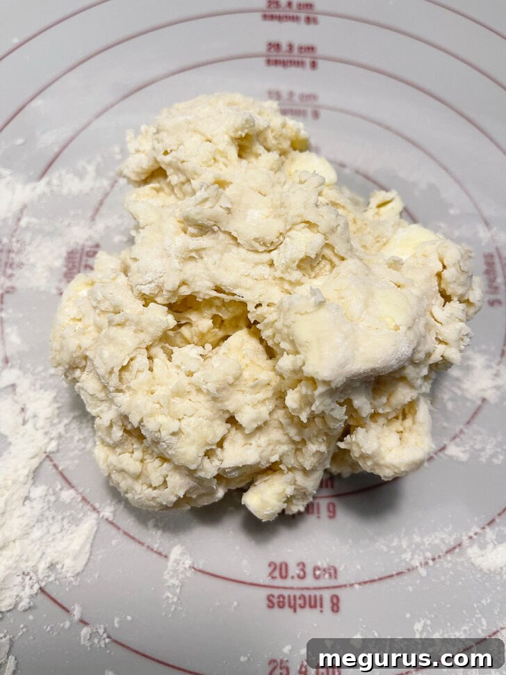Scone dough placed on a lightly floured work surface.