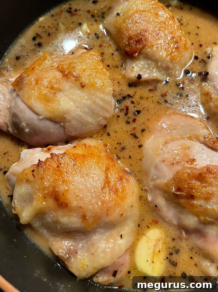 Chicken returned to the skillet.
