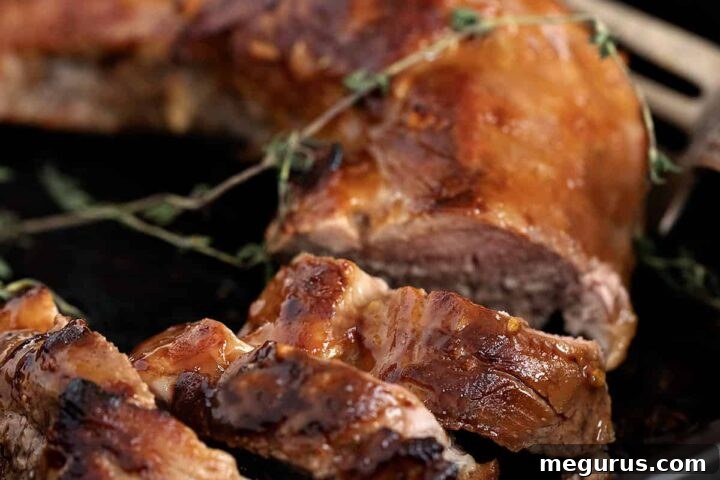 Perfectly cooked marinated pork tenderloin in cast iron skillet