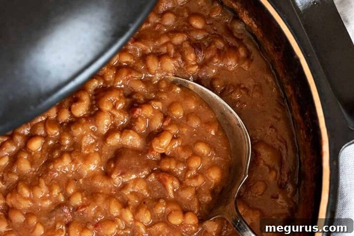 maple baked beans in pot with spoon