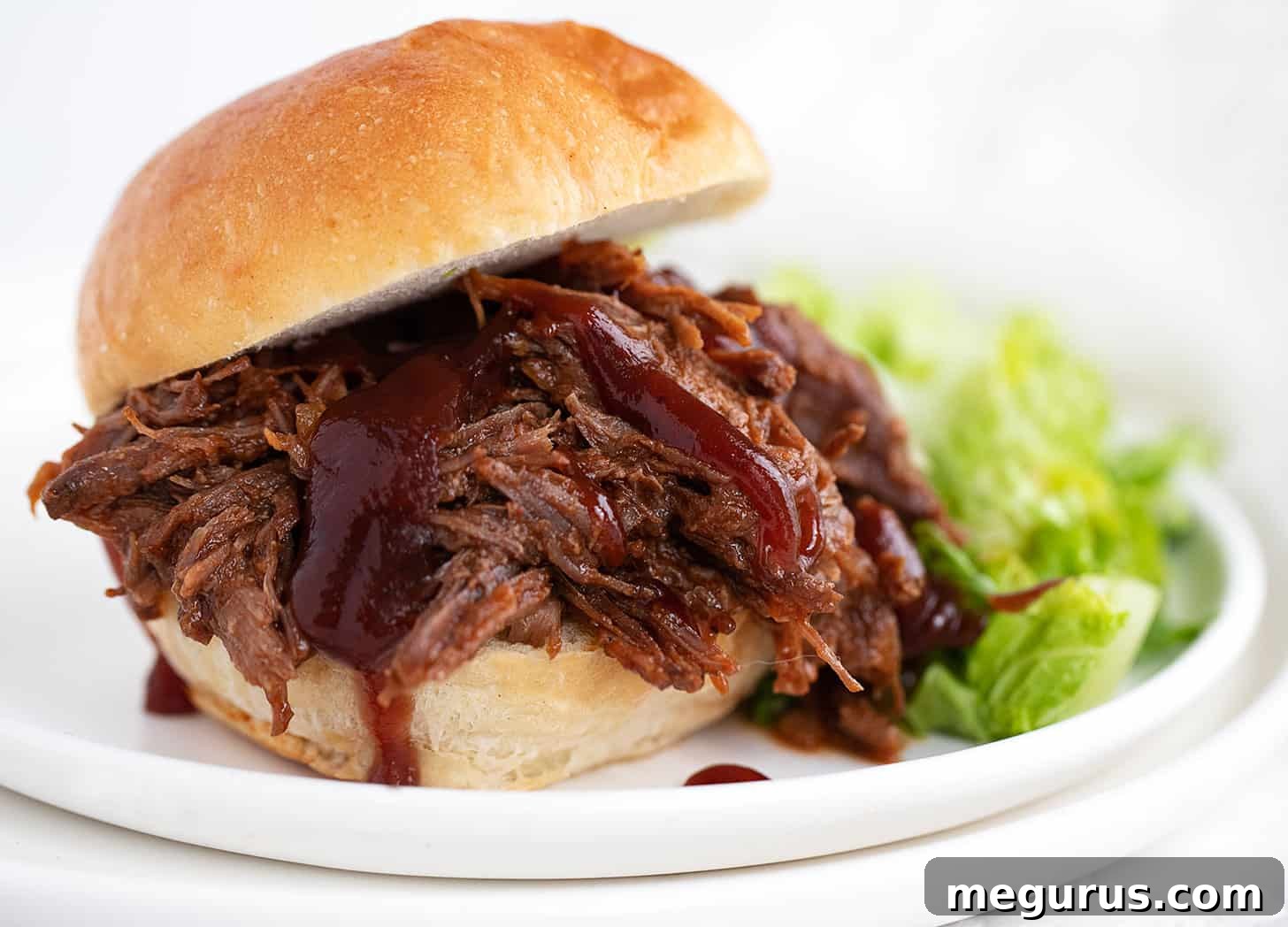 bbq beef on bun with bbq sauce