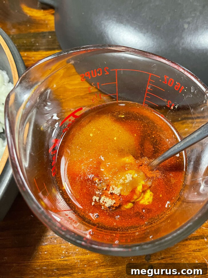 Sauce ingredients mixed in a measuring cup.