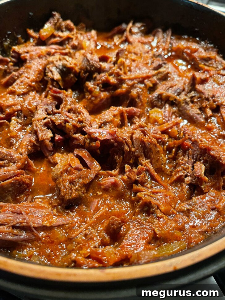 BBQ beef shredded in the baking dish.