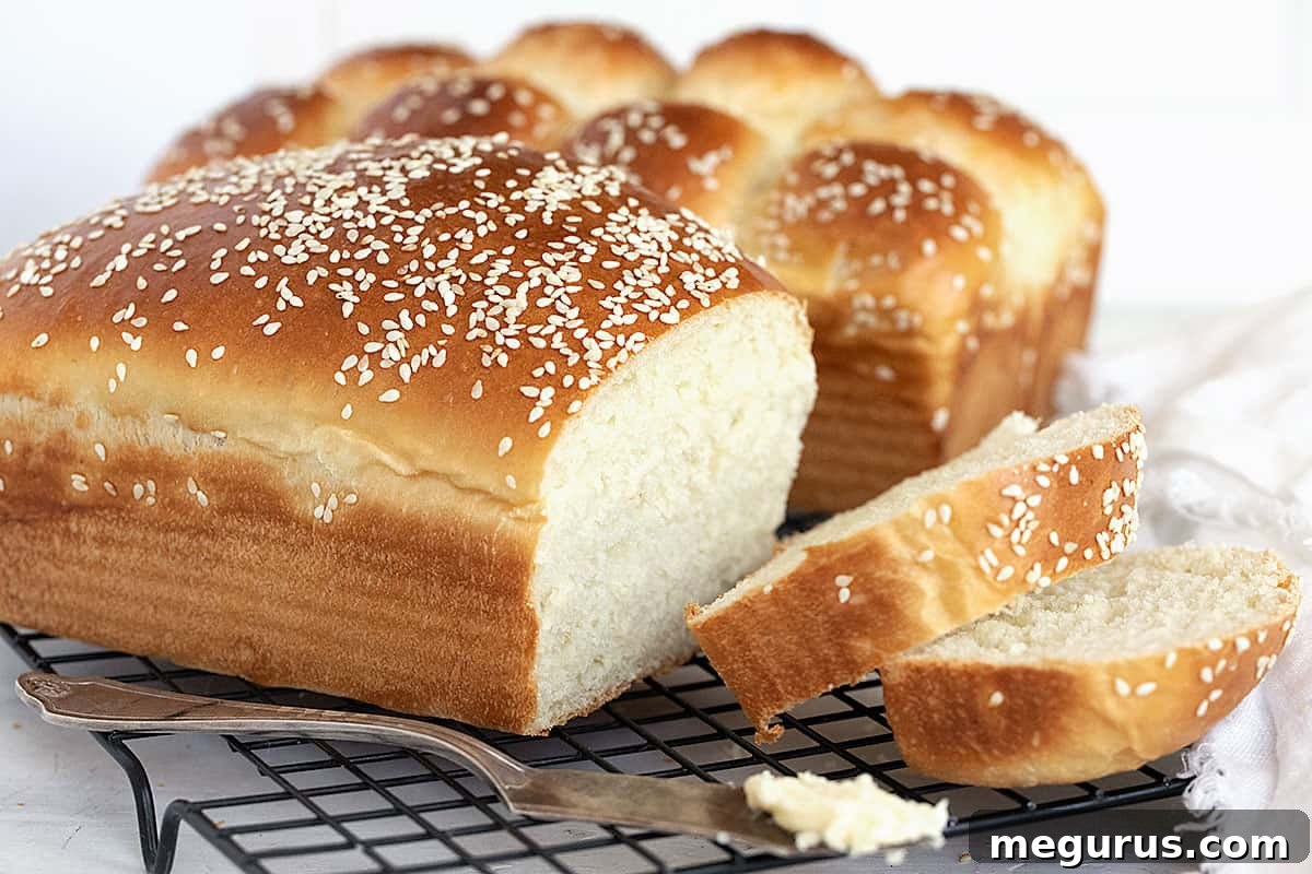 buttermilk bread loaves sliced on cooling rack