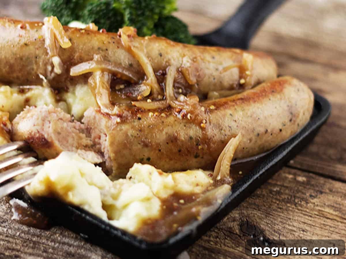 Classic Bangers and Mash with Onion Gravy in a Skillet