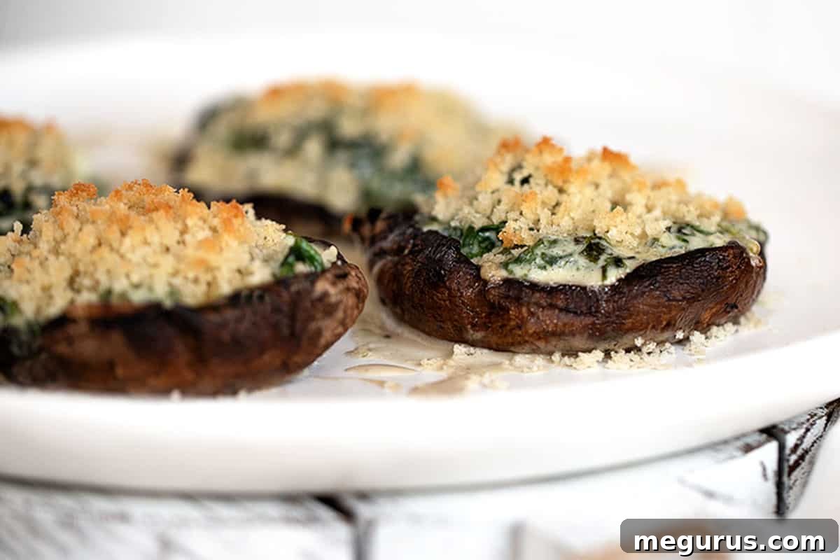 creamed spinach stuffed portobello mushrooms on plate