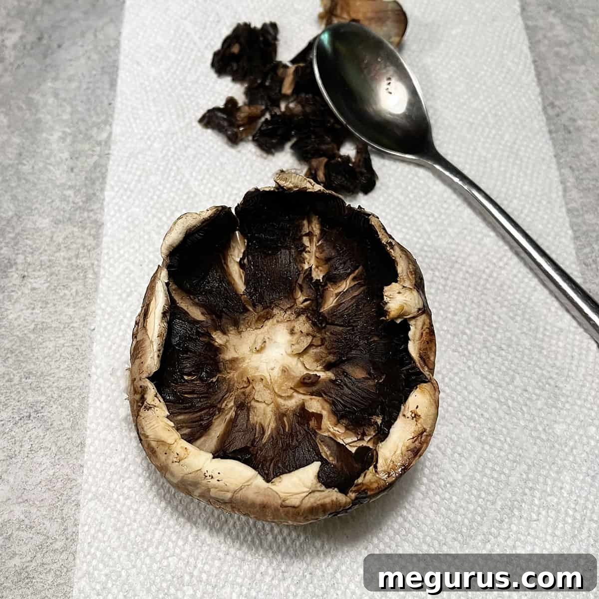 photo of removing the gills of portobello mushrooms