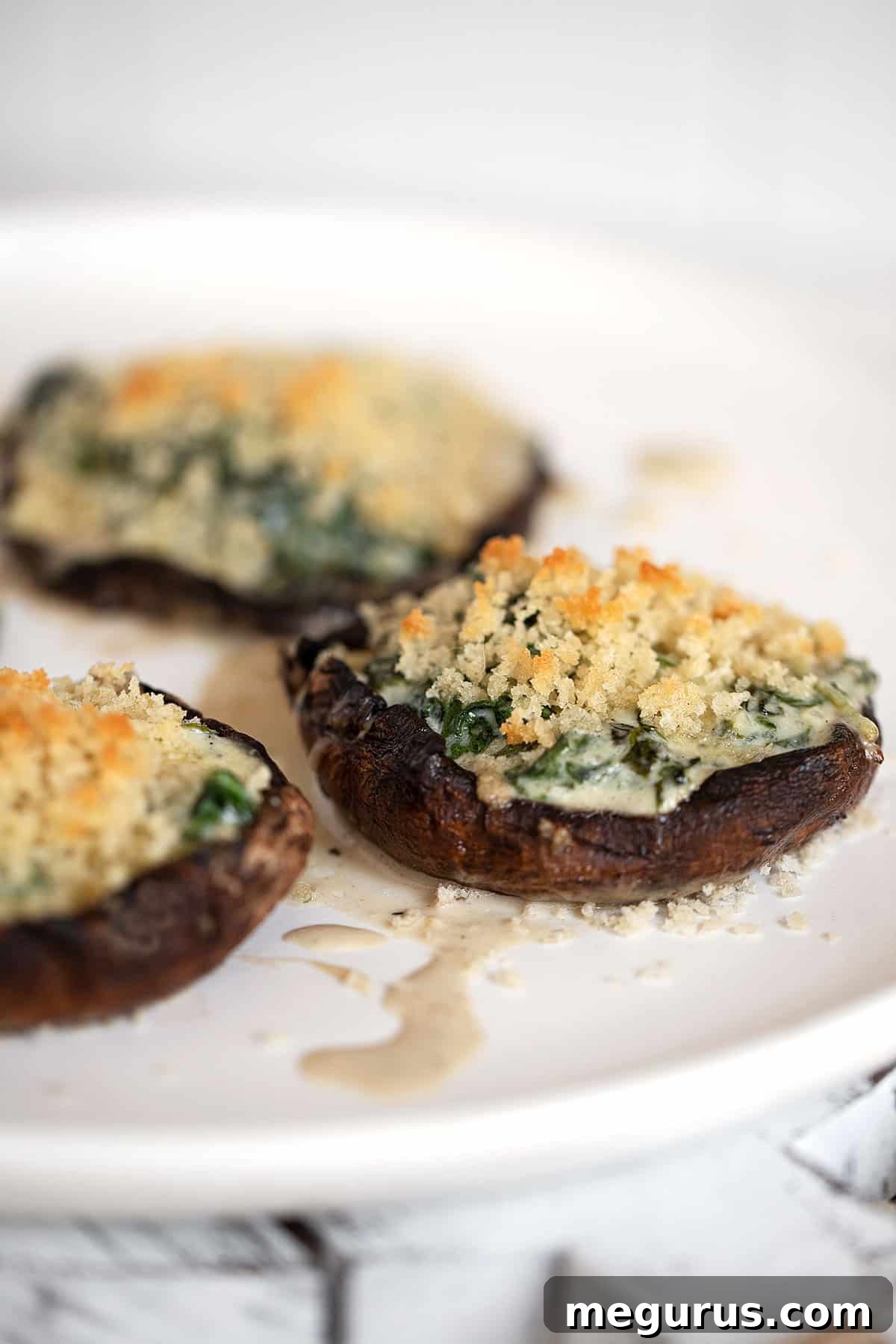 creamed spinach stuffed portobello mushrooms on plate