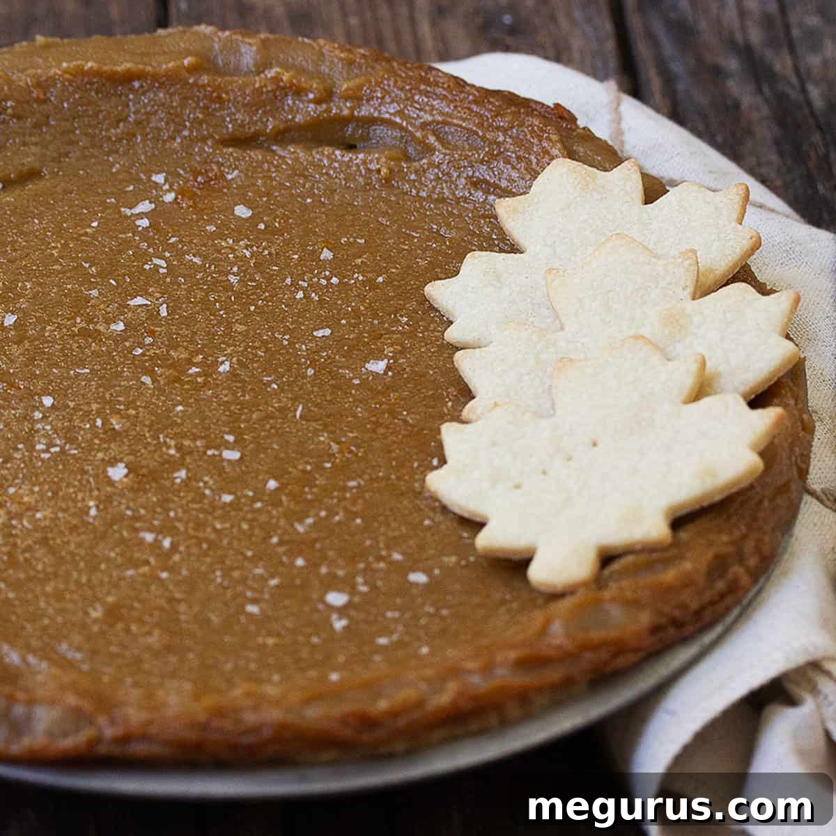 maple syrup pie in pan with pastry maple leaves on top