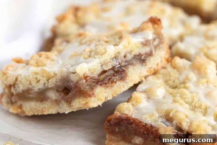Close-up of freshly baked apple streusel bars, golden brown and enticing.