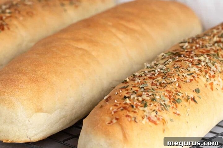 close-up of freshly baked sub buns on a cooling rack
