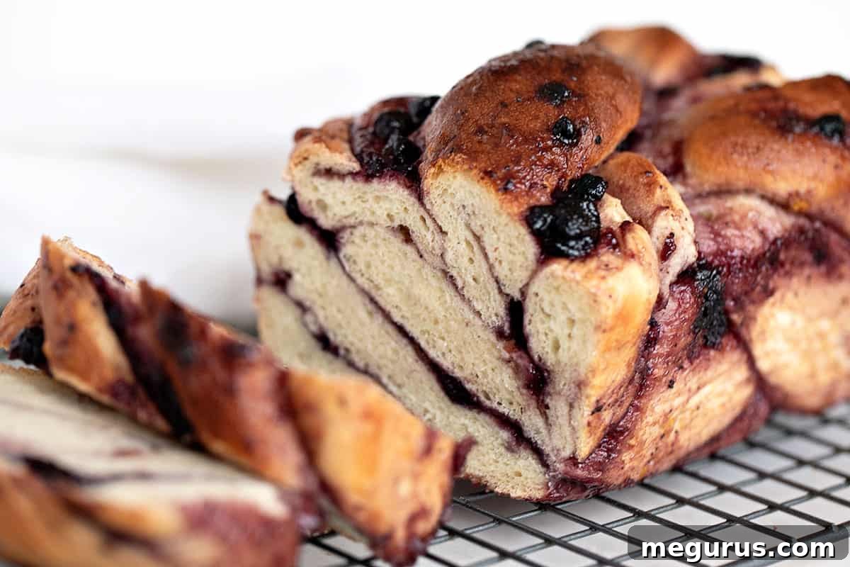 blueberry swirl bread sliced on cooling rack