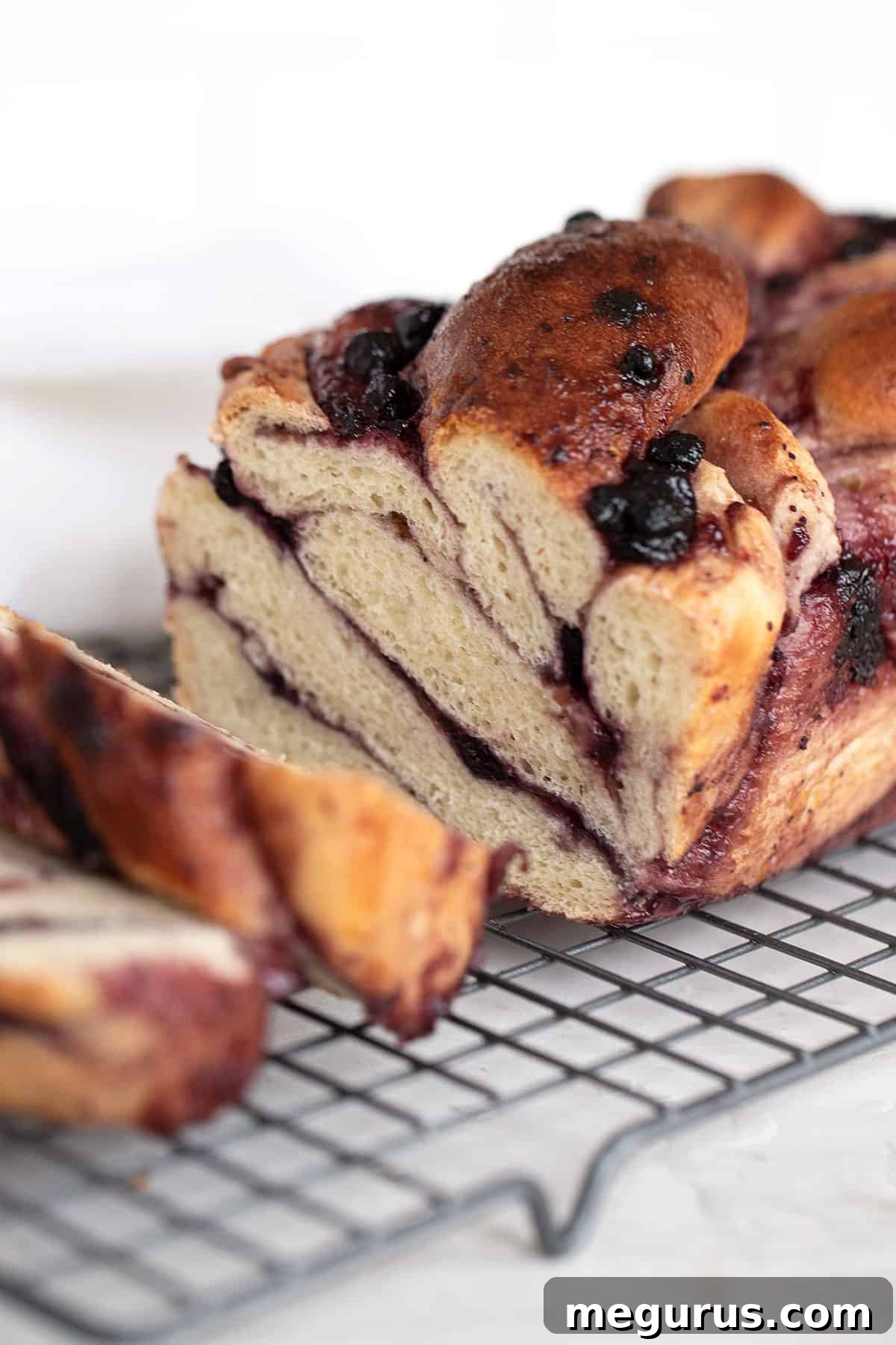 blueberry swirl bread sliced on cooling rack