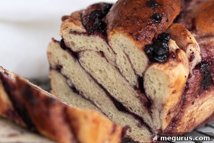 blueberry swirl bread sliced on cooling rack
