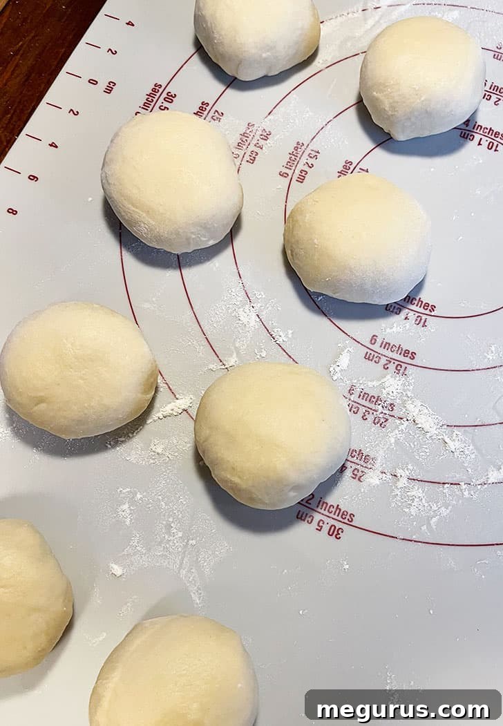 Dough divided into 8 equal pieces, neatly portioned for shaping